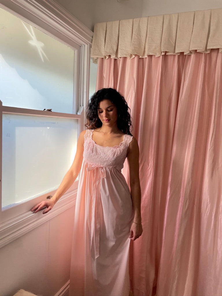 Vintage 1960s Vanity Fair pink slip dress with lace trim and bow