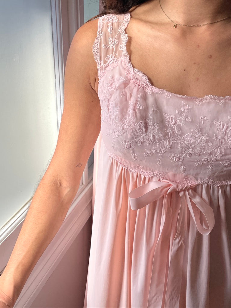 Vintage 1960s Vanity Fair pink slip dress with lace trim and bow