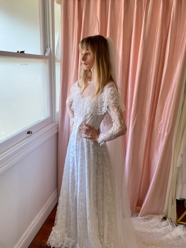 Vintage 80s dramatic lace long sleeve wedding gown with train Mondo Archive Vintage 80s dramatic lace long sleeve wedding gown with train Mondo Archive