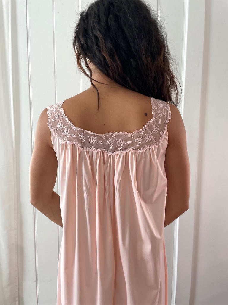 Vintage 1960s Vanity Fair pink slip dress with lace trim and bow