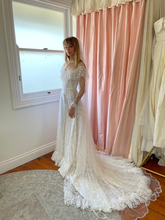 Vintage 80s dramatic lace long sleeve wedding gown with train